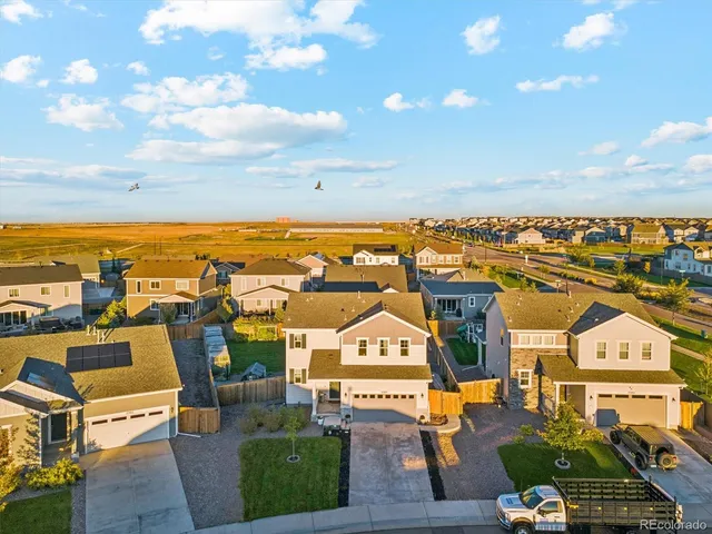 an aerial view of a house with a garden space