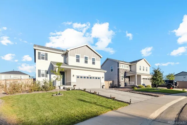 a view of a porch with a table and chairs