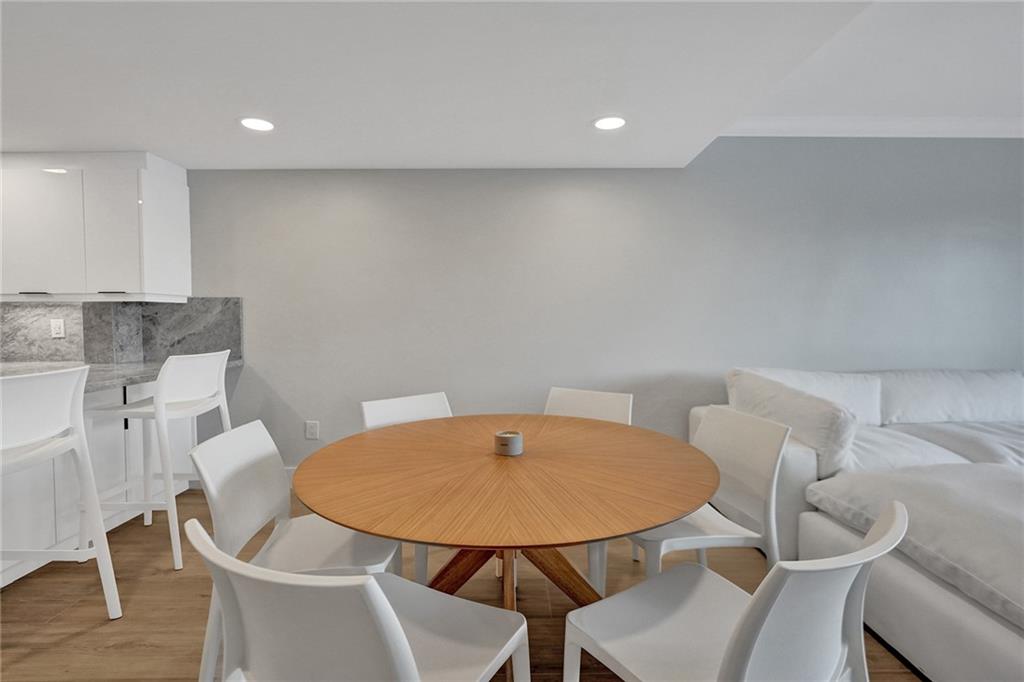 876 Jeffery Street Boca Raton, FL 33487 - Photo 12 of 52 a balcony with table and chairs