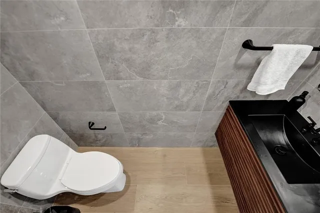 a bathroom with a toilet and a sink