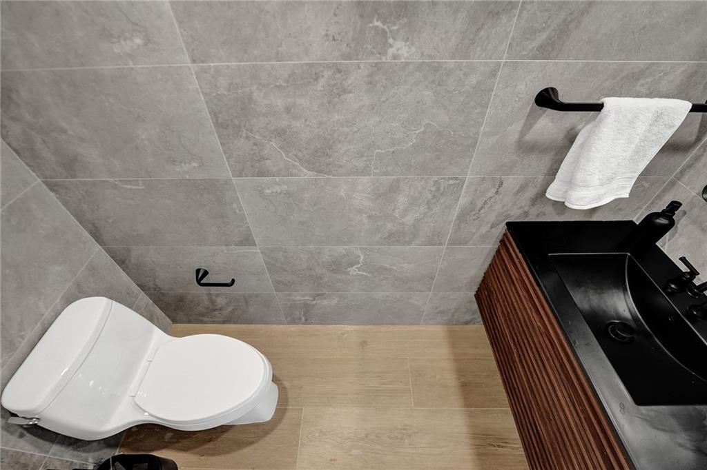 876 Jeffery Street Boca Raton, FL 33487 - Photo 14 of 52 a bathroom with a toilet and a sink