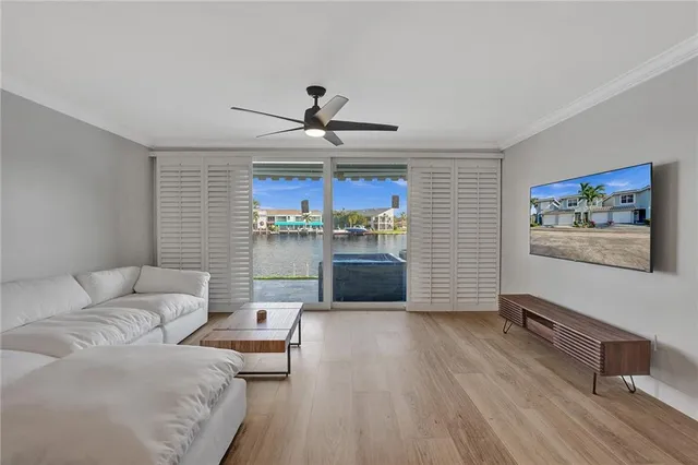 a living room with furniture and kitchen view