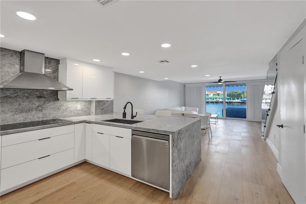876 Jeffery Street Boca Raton, FL 33487 - Photo 2 of 52 a kitchen with a sink stove and refrigerator