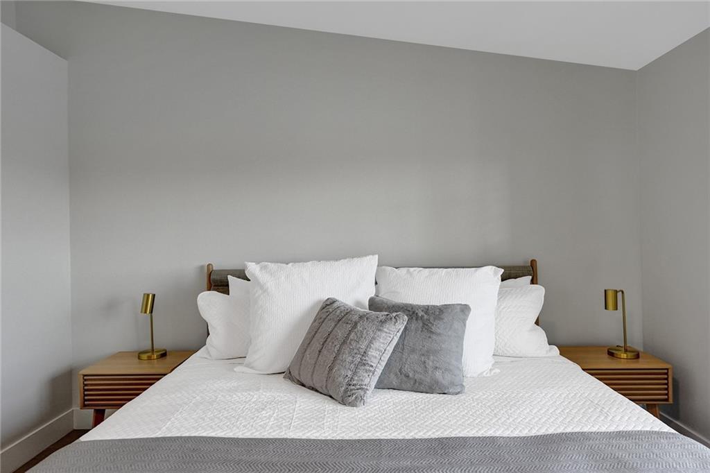 876 Jeffery Street Boca Raton, FL 33487 - Photo 23 of 52 a large bed sitting in a bedroom and lamp