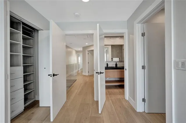 a bathroom with a double vanity sink and mirror