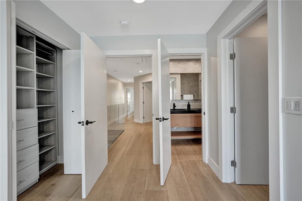 876 Jeffery Street Boca Raton, FL 33487 - Photo 24 of 52 a view of a hallway with wooden floor and closet