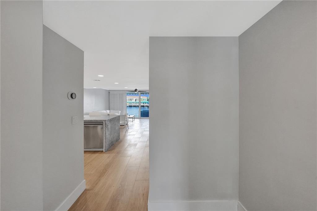 876 Jeffery Street Boca Raton, FL 33487 - Photo 41 of 52 a view of kitchen and wooden floor