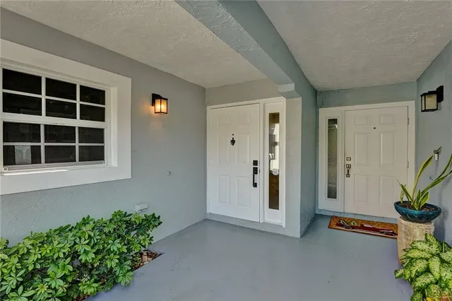 a living room with kitchen island granite countertop furniture and a fireplace