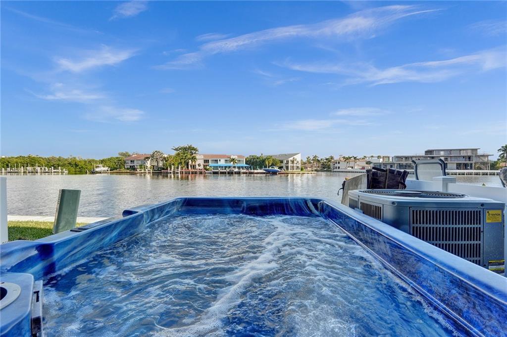 876 Jeffery Street Boca Raton, FL 33487 - Photo 43 of 52 a view of a lake with houses in the back