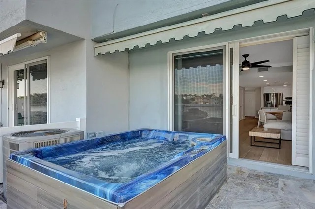 an aerial view of residential houses with outdoor space and river