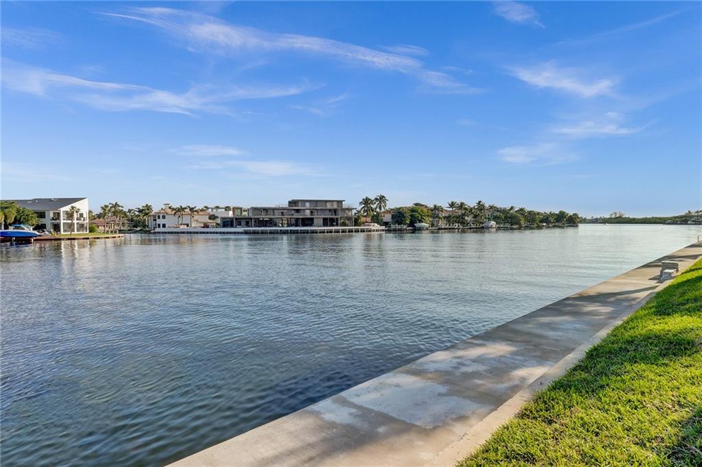 876 Jeffery Street Boca Raton, FL 33487 - Photo 49 of 52 a view of a lake with houses