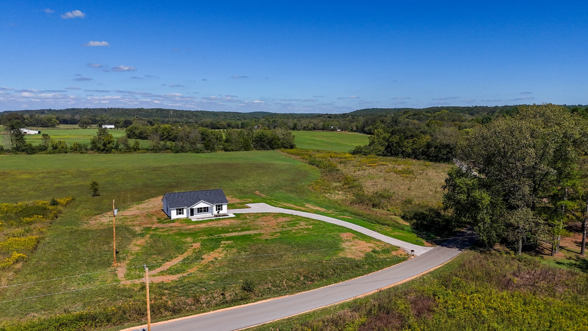 6261 Piney River Road Dickson, TN 37055 - Photo 1 of 32 a view of a field with an outdoor space