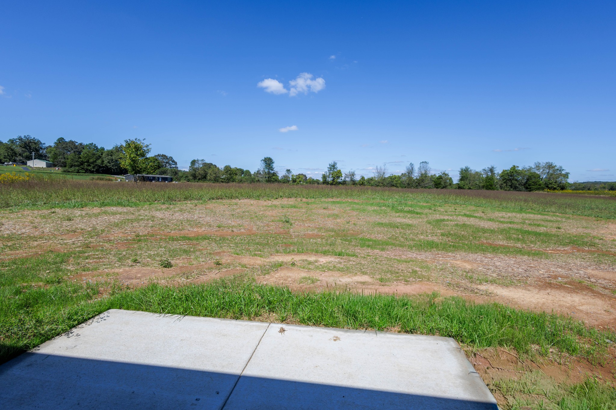 6261 Piney River Road Dickson, TN 37055 - Photo 13 of 32 a view of a lake with houses in the back