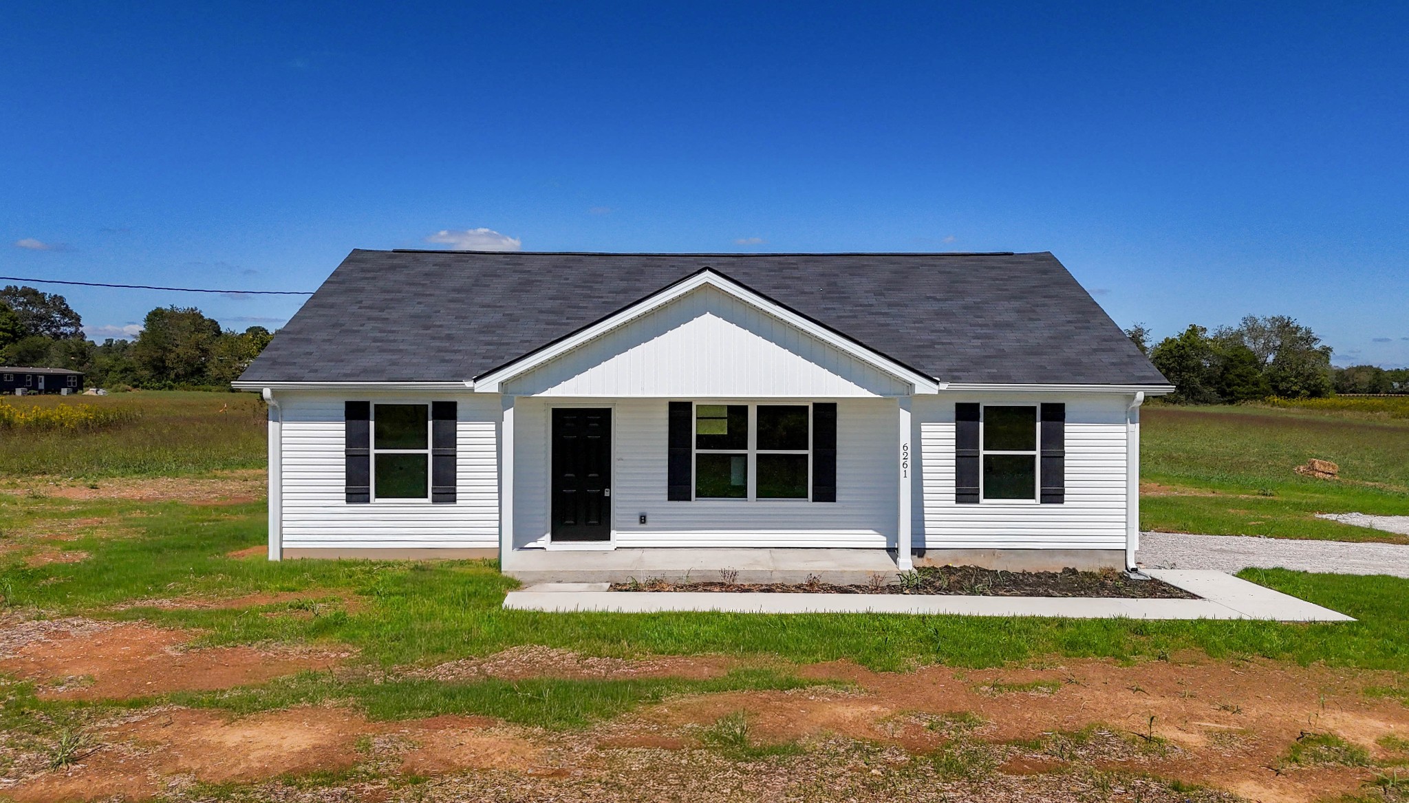 6261 Piney River Road Dickson, TN 37055 - Photo 2 of 32 a front view of a house with a garden