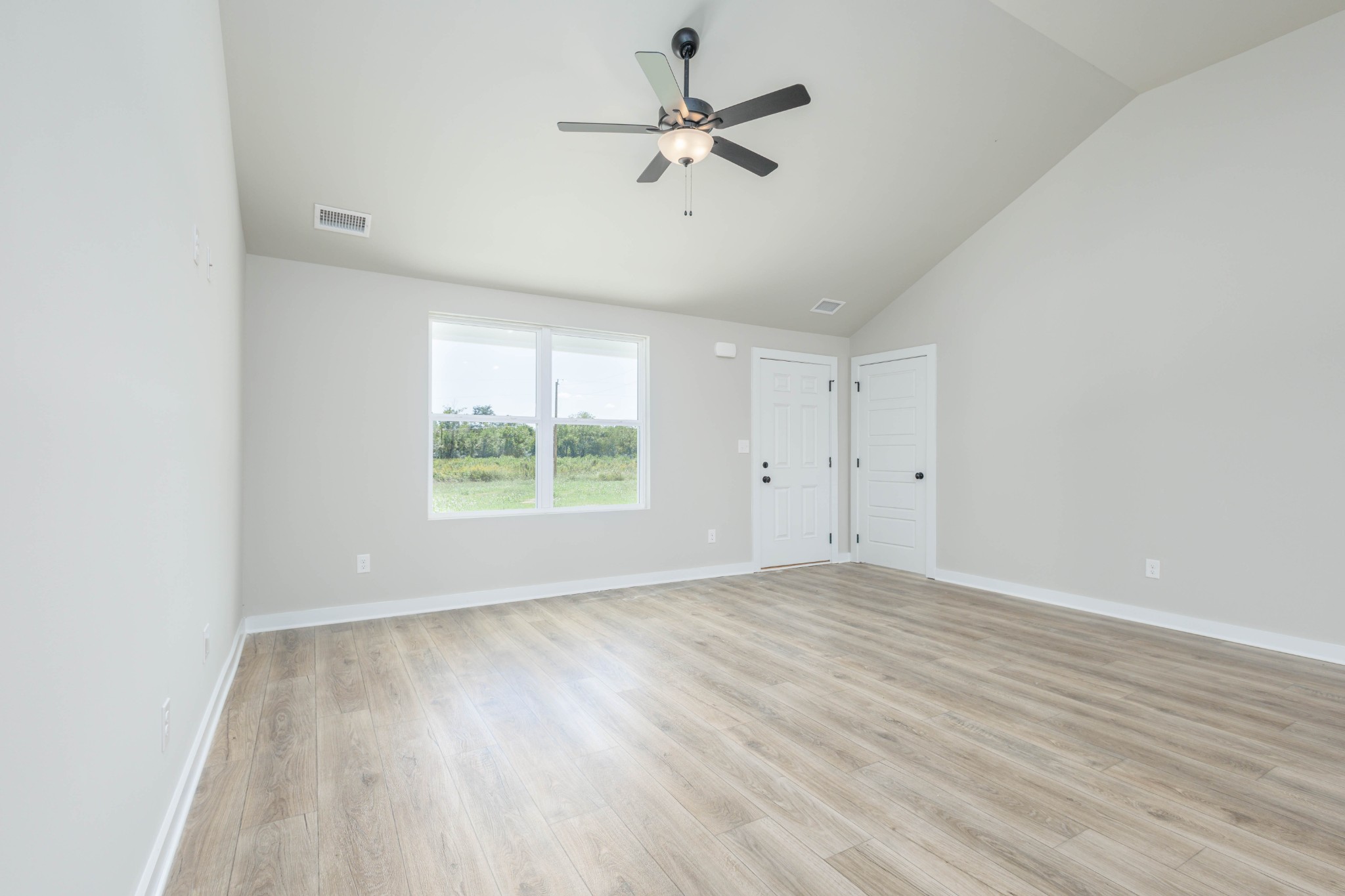 6261 Piney River Road Dickson, TN 37055 - Photo 21 of 32 wooden floor in an empty room with a window