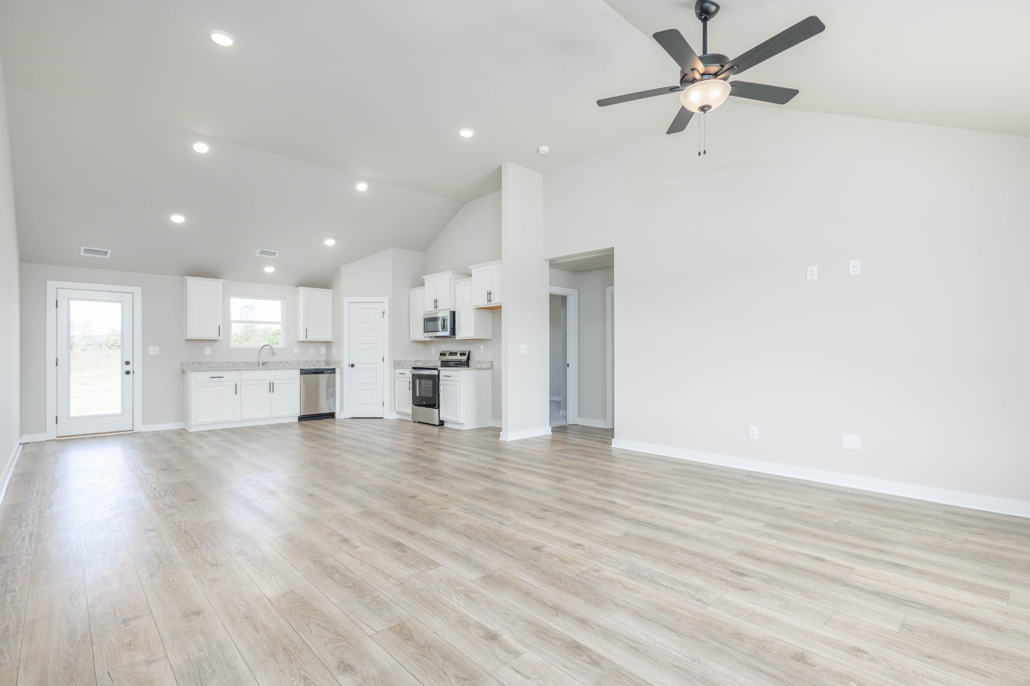 6261 Piney River Road Dickson, TN 37055 - Photo 22 of 32 a view of kitchen with wooden floor and window