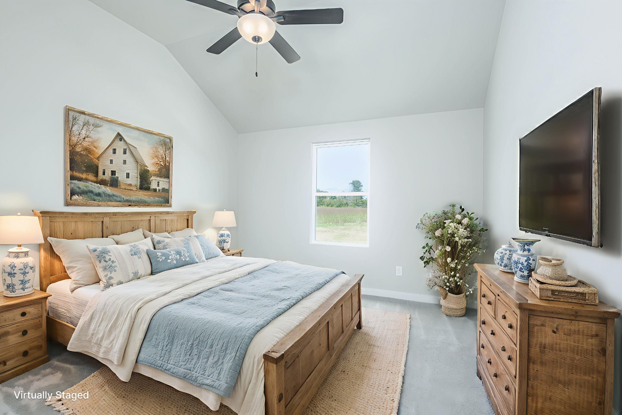 6261 Piney River Road Dickson, TN 37055 - Photo 23 of 32 a bedroom with a large bed and a flat screen tv