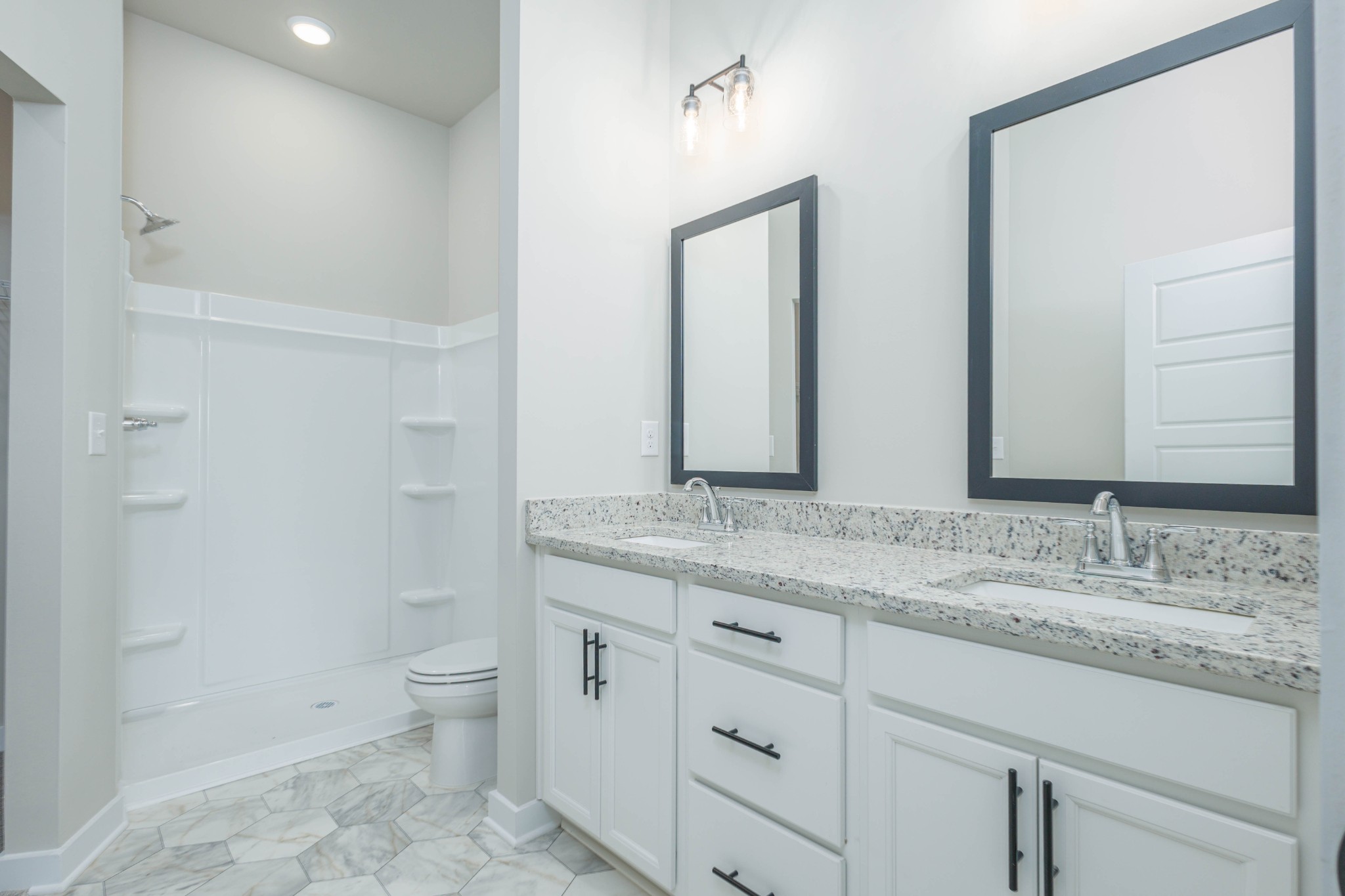 6261 Piney River Road Dickson, TN 37055 - Photo 26 of 32 a bathroom with a granite countertop sink a toilet and a mirror