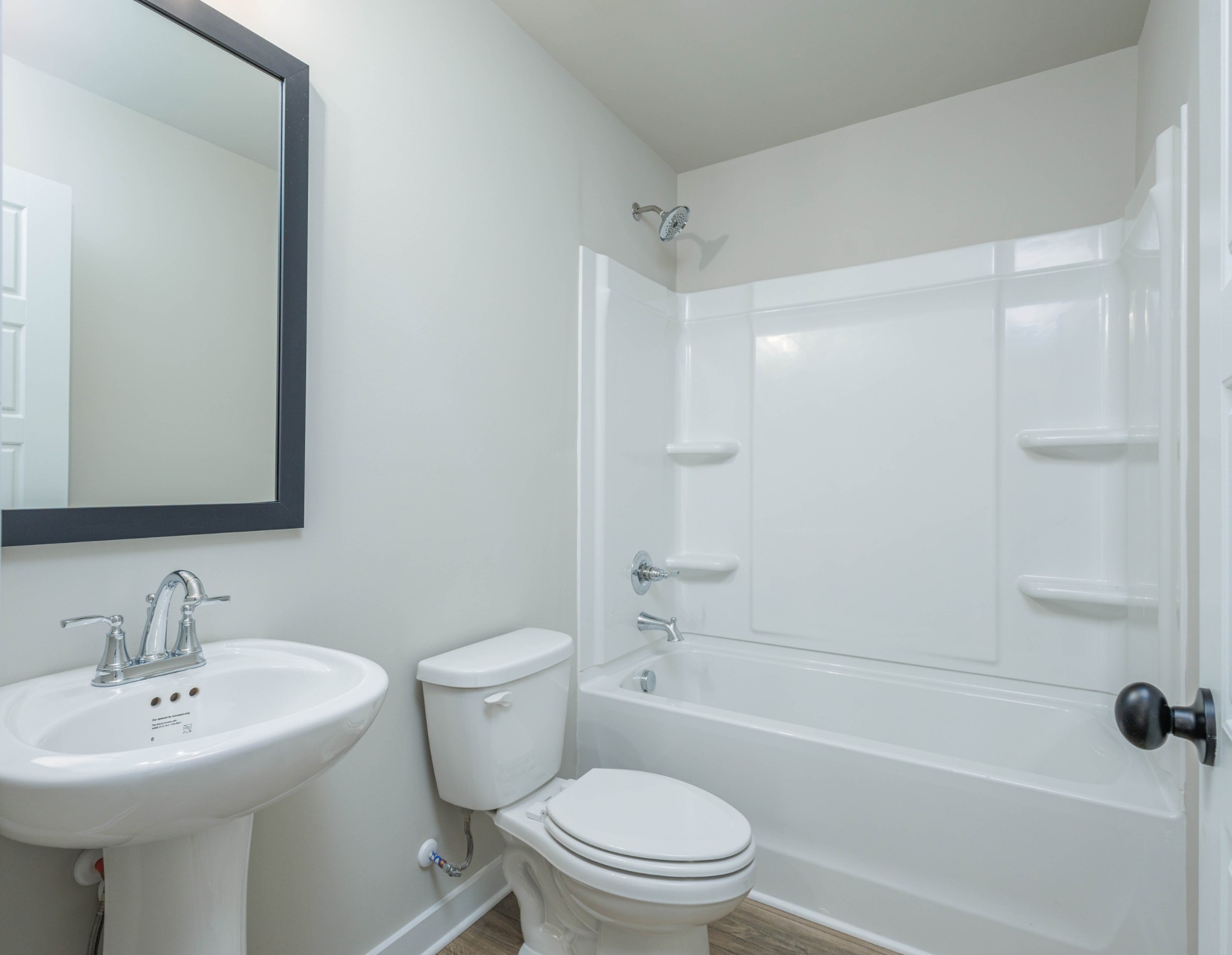 6261 Piney River Road Dickson, TN 37055 - Photo 32 of 32 a bathroom with a sink toilet and shower
