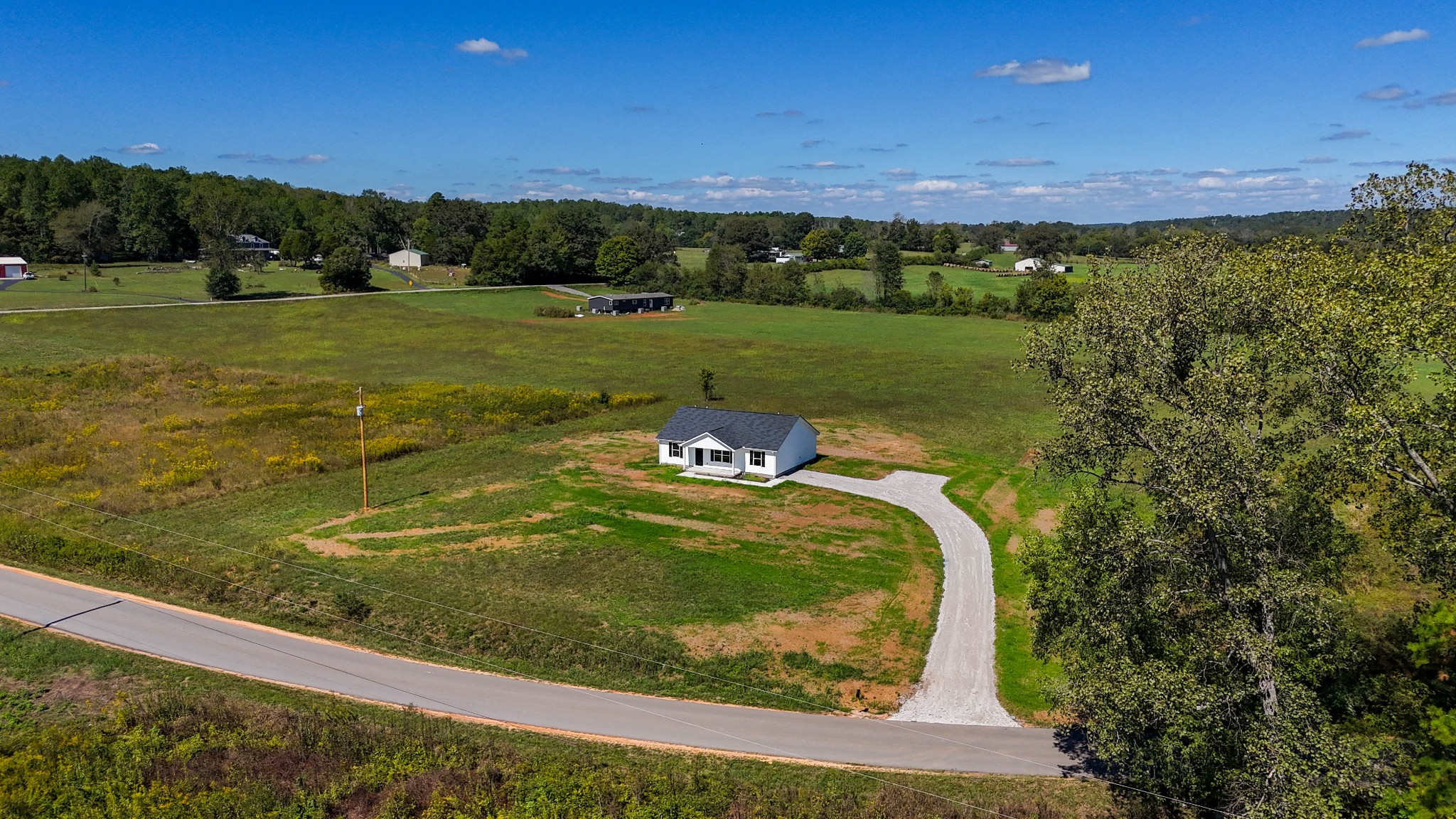 6261 Piney River Road Dickson, TN 37055 - Photo 6 of 32 a view of a lake from a yard