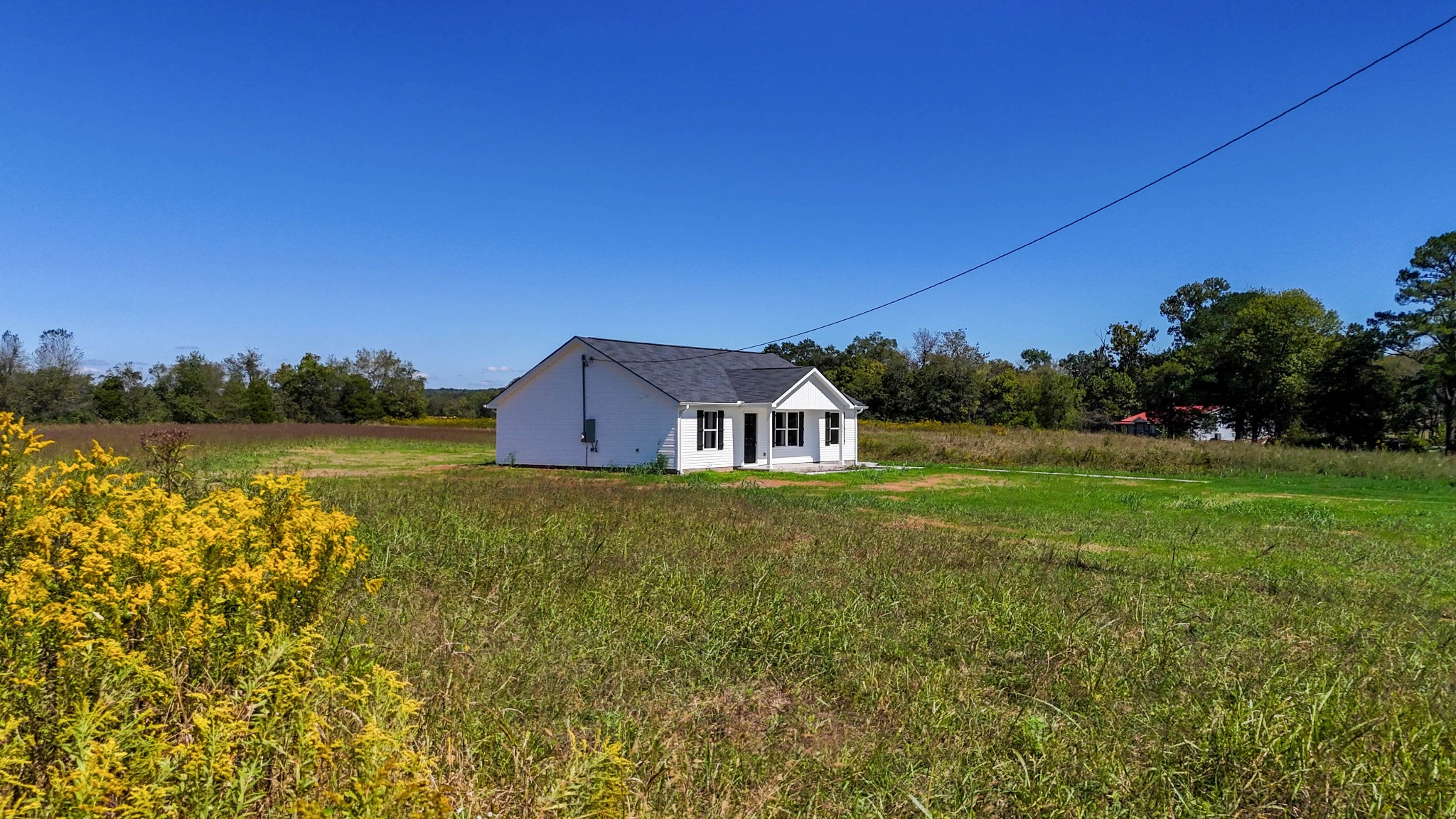 6261 Piney River Road Dickson, TN 37055 - Photo 9 of 32 a view of a house with a yard