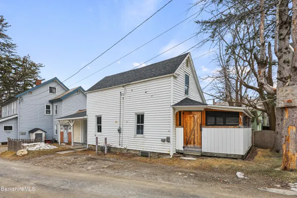 a front view of a house with garage