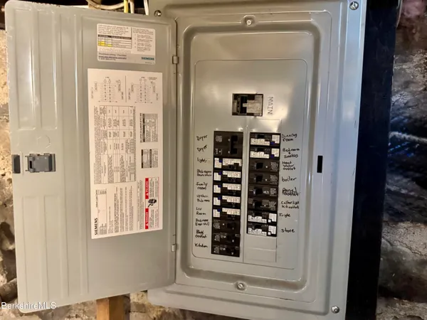 a view of front door with wooden floor