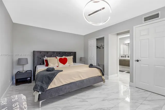 a bedroom with bed and a window