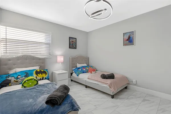 a bedroom with a bed and a couch