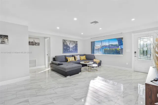 a living room with furniture and a couch
