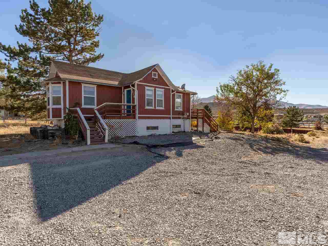 8515 Gate Street Reno, NV 89506 - Photo 1 of 19 a front view of a house with a yard
