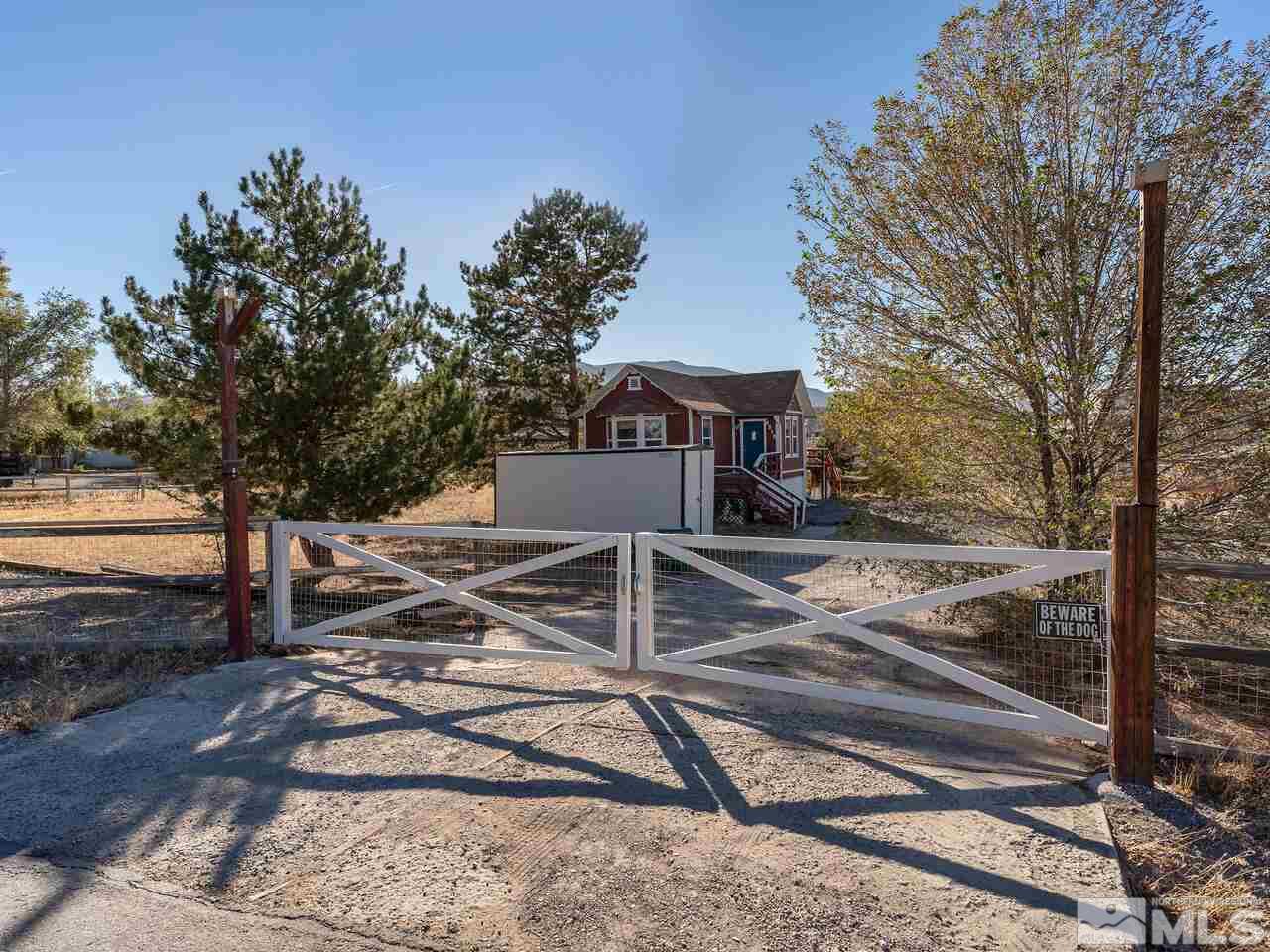 8515 Gate Street Reno, NV 89506 - Photo 2 of 19 a view of a yard with wooden fence