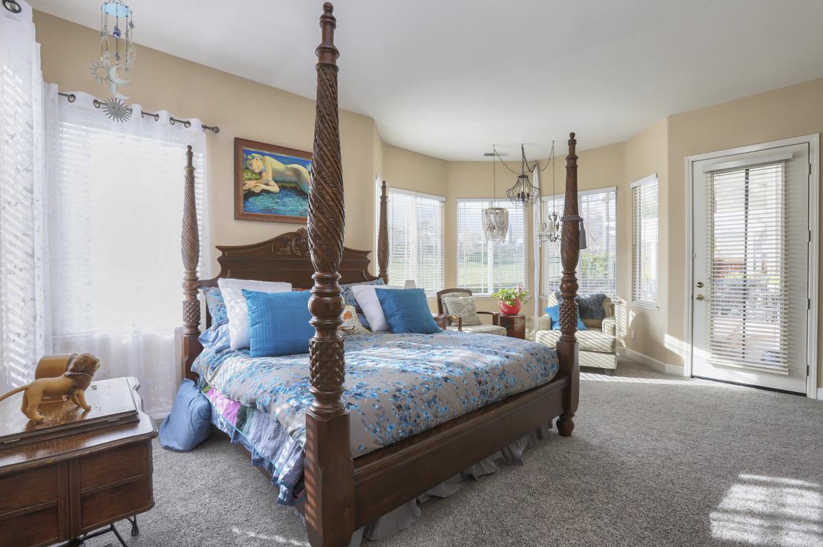 1949 St Andrews Circle, Unit CL Gilroy, CA 95020 - Photo 11 of 21 a bedroom with a bed and large window