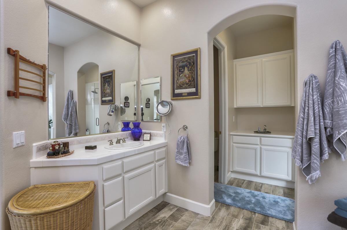 1949 St Andrews Circle, Unit CL Gilroy, CA 95020 - Photo 13 of 21 a bathroom with a sink a toilet and mirror