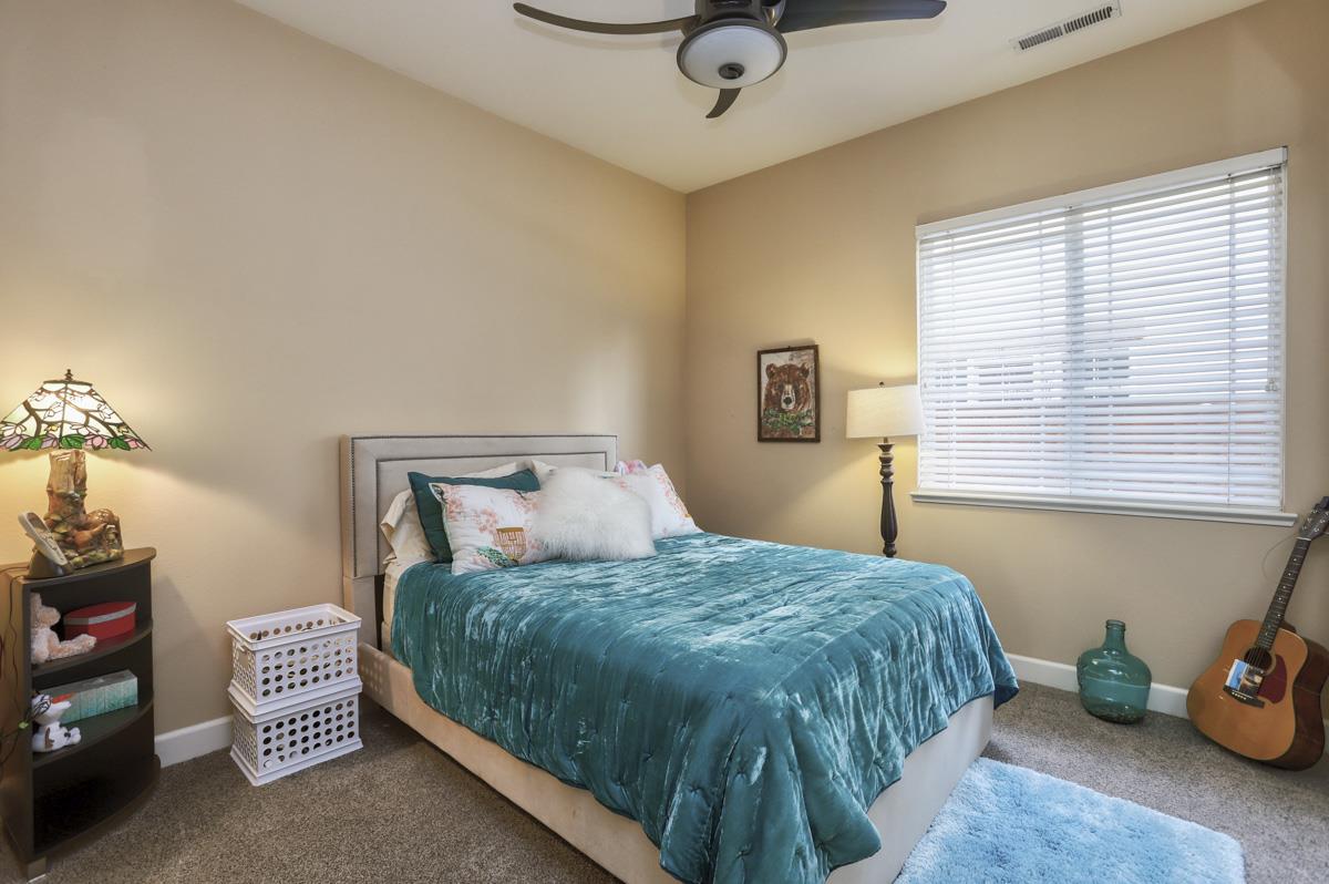 1949 St Andrews Circle, Unit CL Gilroy, CA 95020 - Photo 15 of 21 a bedroom with a bed and a window