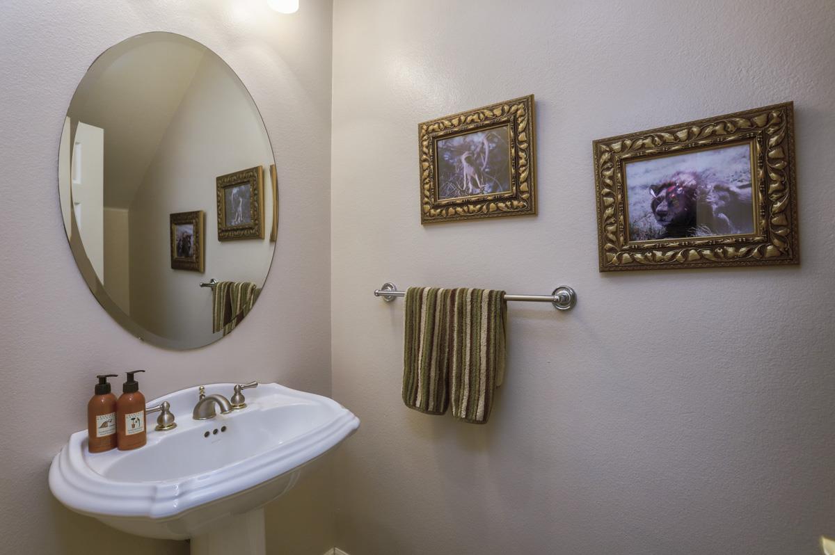 1949 St Andrews Circle, Unit CL Gilroy, CA 95020 - Photo 18 of 21 a bathroom with a sink and a mirror