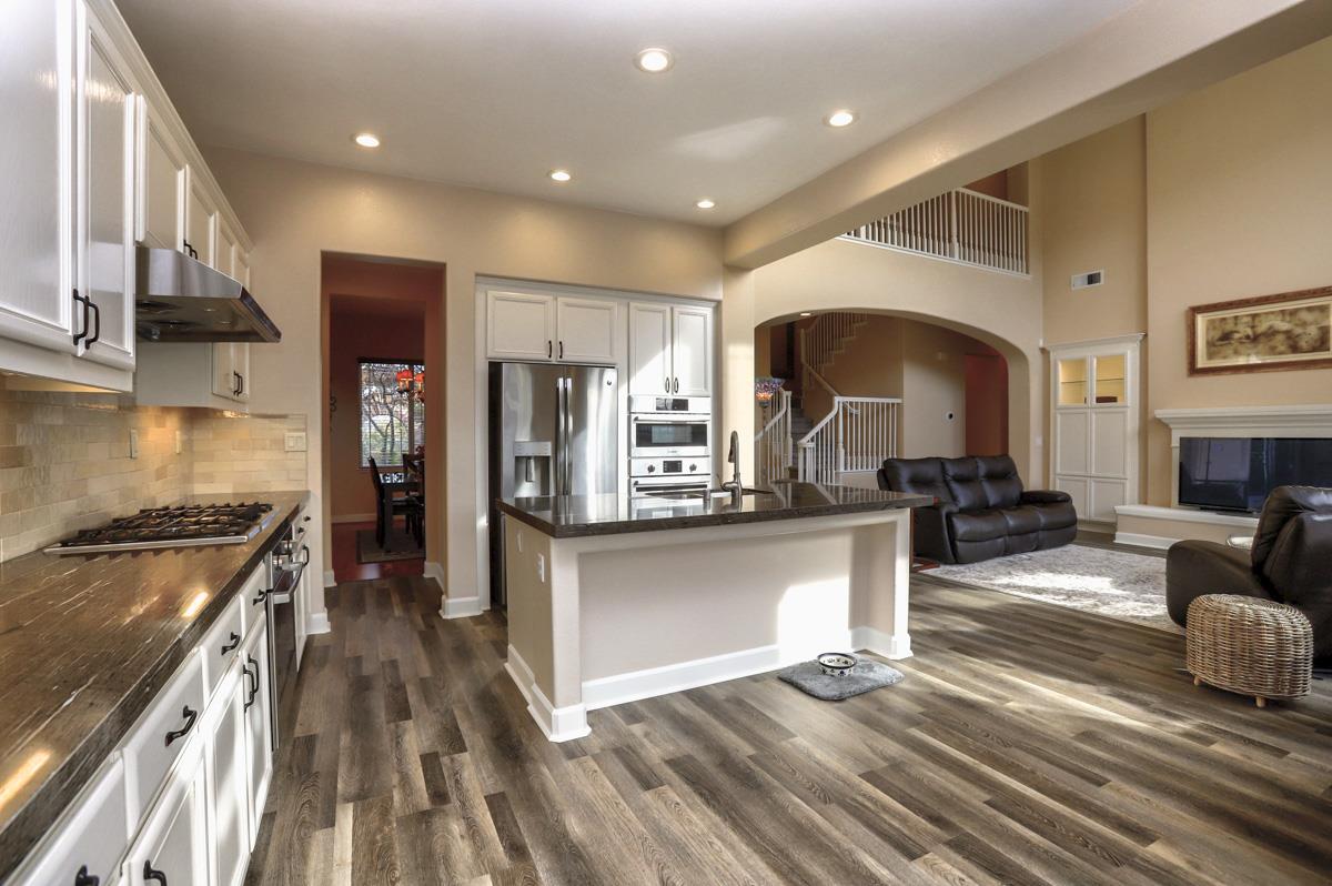 1949 St Andrews Circle, Unit CL Gilroy, CA 95020 - Photo 8 of 21 a kitchen with stainless steel appliances granite countertop a sink stove and refrigerator
