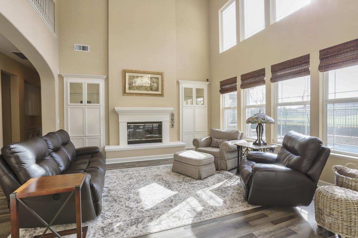 1949 St Andrews Circle, Unit CL Gilroy, CA 95020 - Photo 10 of 21 a living room with furniture and a fireplace