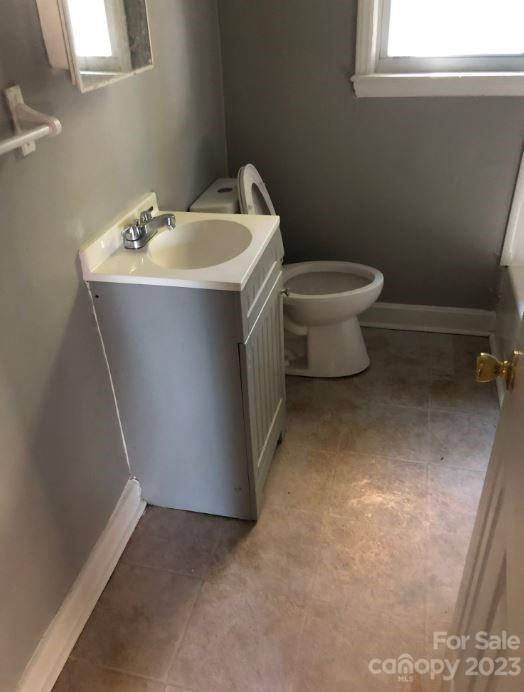 1702 Newland Road Charlotte, NC 28216 - Photo 12 of 34 a bathroom with a sink toilet and window
