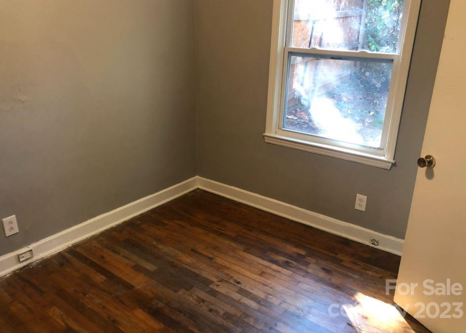 1702 Newland Road Charlotte, NC 28216 - Photo 15 of 34 a view of a small space with wooden floor and a window