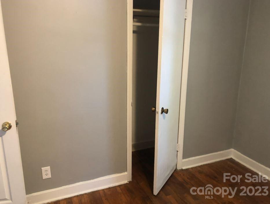 1702 Newland Road Charlotte, NC 28216 - Photo 18 of 34 an empty room with wooden floor