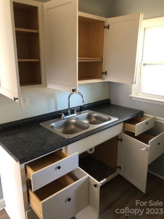 1702 Newland Road Charlotte, NC 28216 - Photo 25 of 34 a kitchen with a sink cabinets and window