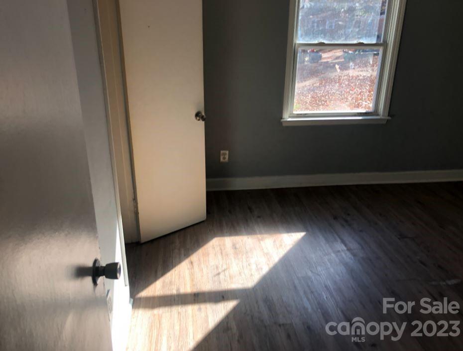 1702 Newland Road Charlotte, NC 28216 - Photo 30 of 34 a view of a room has wooden floor and windows