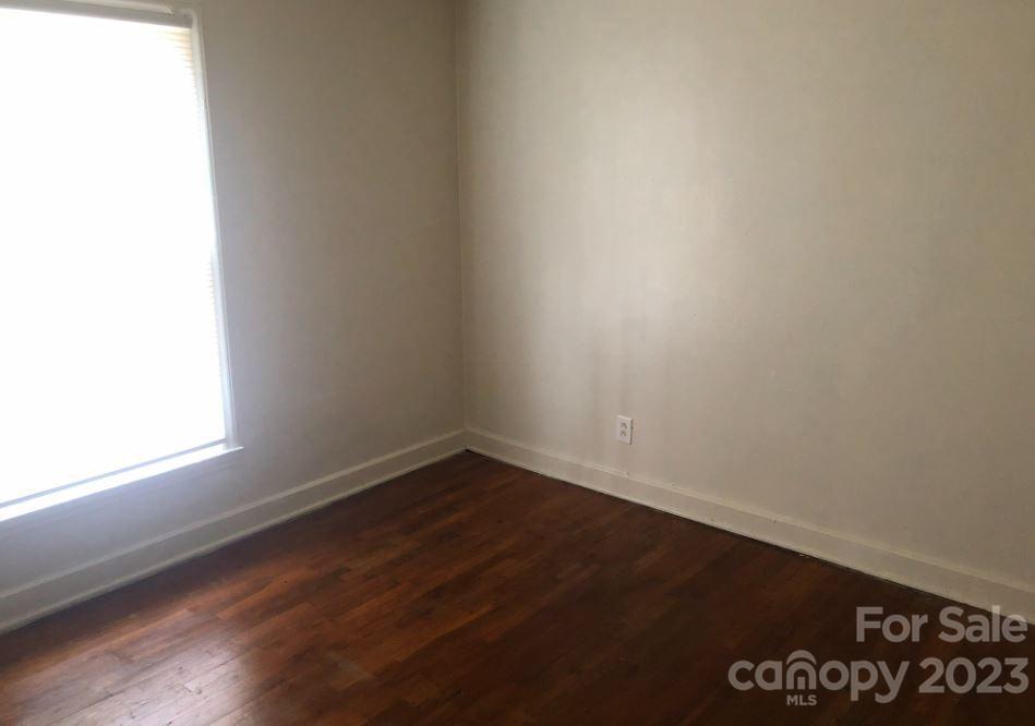 1702 Newland Road Charlotte, NC 28216 - Photo 34 of 34 a view of an empty room with wooden floor