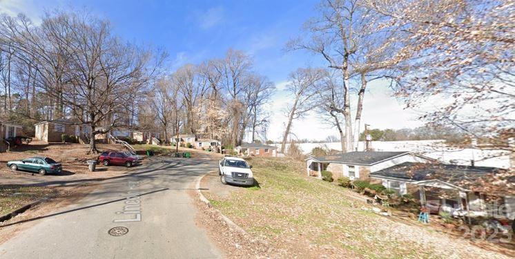 1702 Newland Road Charlotte, NC 28216 - Photo 4 of 34 a view of a backyard with large trees