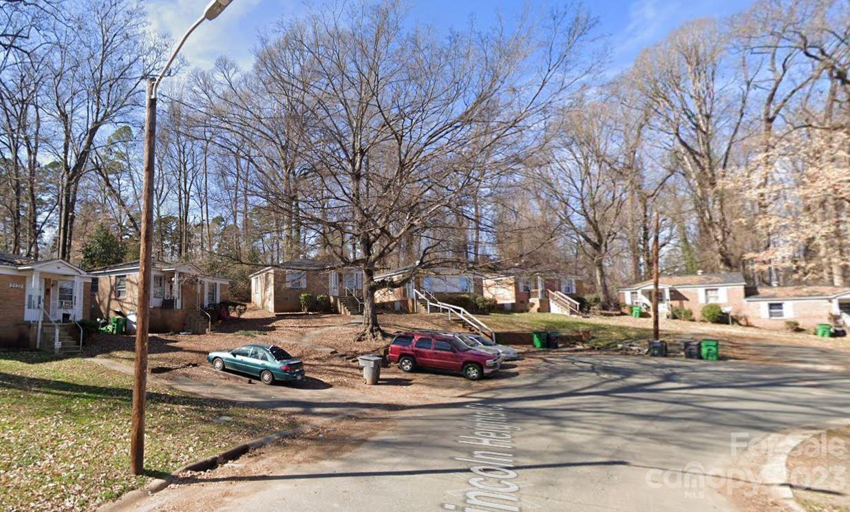 1702 Newland Road Charlotte, NC 28216 - Photo 5 of 34 a view of road with a barbeque and large trees