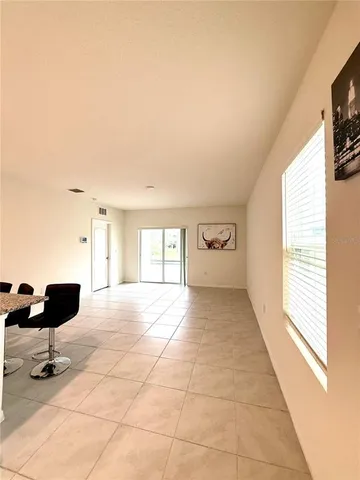 a view of an empty room and a window