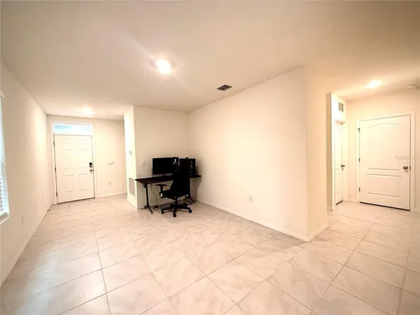 a view of room with workspace and a window