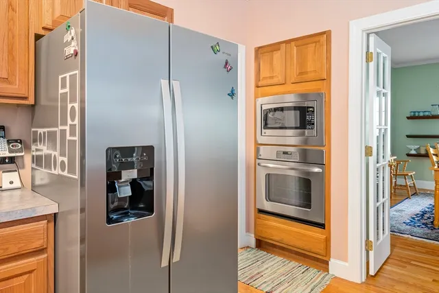 a kitchen with a refrigerator and an oven
