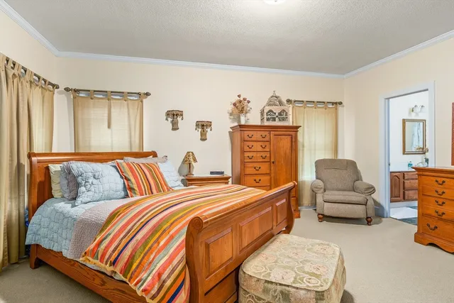 a bedroom with two beds and a couch